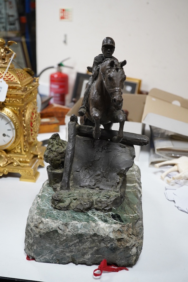 June Harrah (American), bronze group of a racehorse and rider, on a naturalistic green marble base, 30cm high, with paperwork including provenance and exhibition leaflet. Condition - good